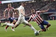 Gareth Bale is flanked by two Atlético players at the Wanda Metropolitano